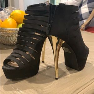 Black bootie with gold heel